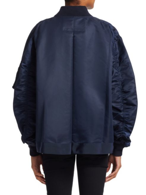 Make a Statement This Fall with a Sacai Bomber Jacket featuring Betsy Brown of popular high end fashion blog, A Few Goody Gumdrops