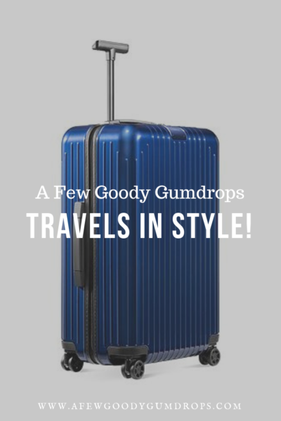 A Few Goody Gumdrops Travels In Style | Chic luggage featured by top high end life and style blog, A Few Goody Gumdrops: image of a blue Rimowa trolley luggage