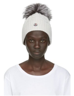 Stay Warm and Fashionable in Chunky Knits featured by top US high end fashion blog, A Few Goody Gumdrops: image of Moncler pom beanie