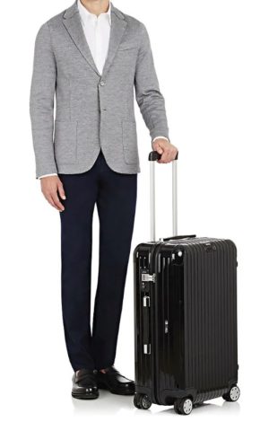 Chic luggage featured by top high end life and style blog, A Few Goody Gumdrops: image of a black Rimowa trolley luggage  