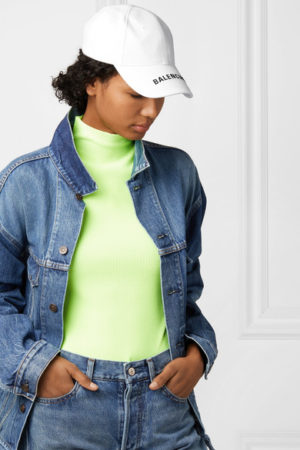 Trendy designer baseball caps featured by top US fashion blog, A Few Goody Gumdrops: image of a woman wearing a Balenciaga baseball cap