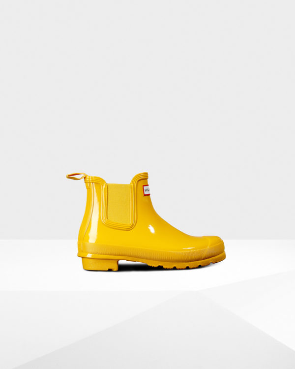 High end fashion blogger, A Few Goody Gumdrops shares designer short rain boots for a rainy day. 