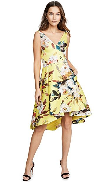 Yellow floral Spring trend featured by top high end fashion blog, A Few Goody Gumdrops: image of a woman wearing a Black Halo yellow floral dress