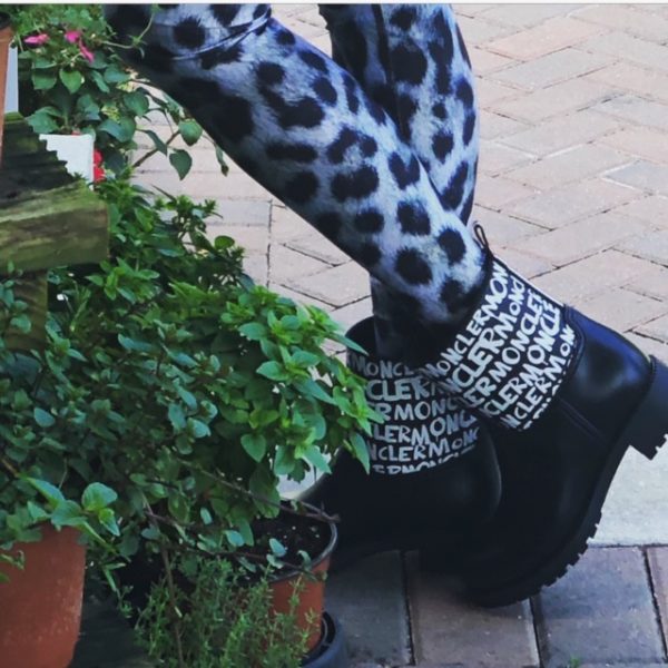 Short rain boots trend featured by top US high end fashion blog, A Few Goody Gumdrops: image of a woman wearing black Moncler short rain boots and leopard leggings