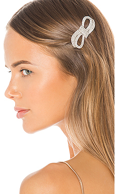 Trendy Hair Clips and Barrettes featured by top US high end fashion blog, A Few Goody Gumdrops: image of a woman wearing a Jennifer Behr glitzy barrette