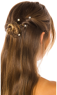 Trendy Hair Clips and Barrettes featured by top US high end fashion blog, A Few Goody Gumdrops: image of a woman wearing a Jennifer Behr glitzy barrette