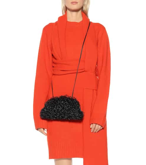 Designer Sponge Bag Designer Sponge Bag Roundup featured by top US high end fashion blog, A Few Goody Gumdrops: image of a woman with a Bottega Veneta Sponge Pouch featured by top US high end fashion blog, A Few Goody Gumdrops: image of a woman with a Bottego Veneta Sponge Pouch