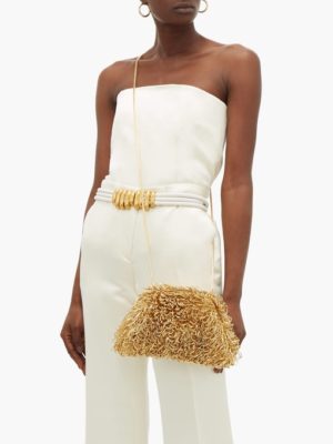 Designer Sponge Bag Roundup featured by top US high end fashion blog, A Few Goody Gumdrops: image of a woman with a Bottega Veneta Sponge Pouch