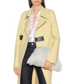 Designer Sponge Bag Roundup featured by top US high end fashion blog, A Few Goody Gumdrops: image of a woman with a Bottega Veneta Sponge Pouch