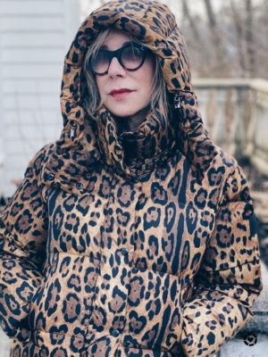 Animal print trend featured by top US high end fashion blog, A Few Goody Gumdrops: image of a woman wearing a SAM leopard print puffer coat