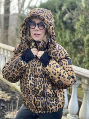 Animal print trend featured by top US high end fashion blog, A Few Goody Gumdrops: image of a woman wearing a SAM leopard print puffer coat