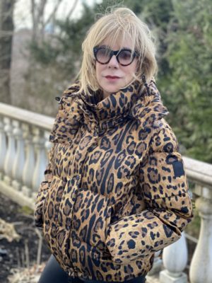 Animal print trend featured by top US high end fashion blog, A Few Goody Gumdrops: image of a woman wearing a SAM leopard print puffer coat