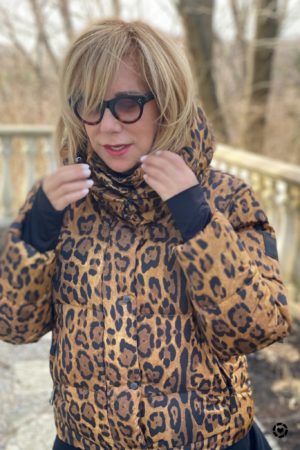 Animal print trend featured by top US high end fashion blog, A Few Goody Gumdrops: image of a woman wearing a SAM leopard print puffer coat